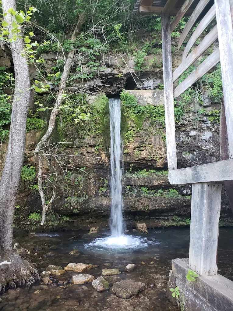 Waterfall beside a historic wooden mill